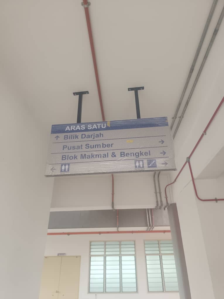 Ceiling hung directional wayfinding sign school corridor Johor