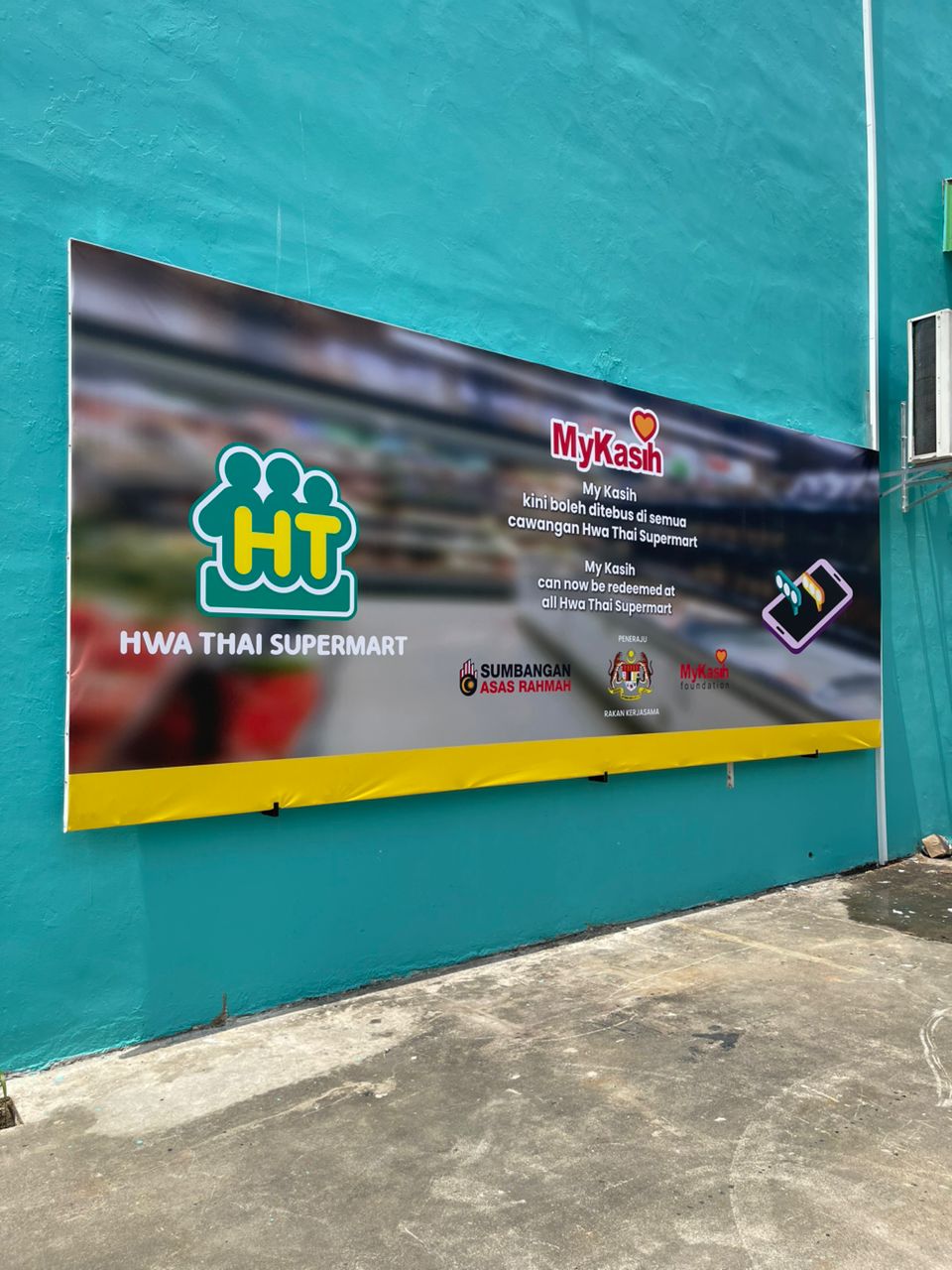 Hwa Thai Supermart giant banner MyKasih partnership promotion exterior wall Plentong JB
