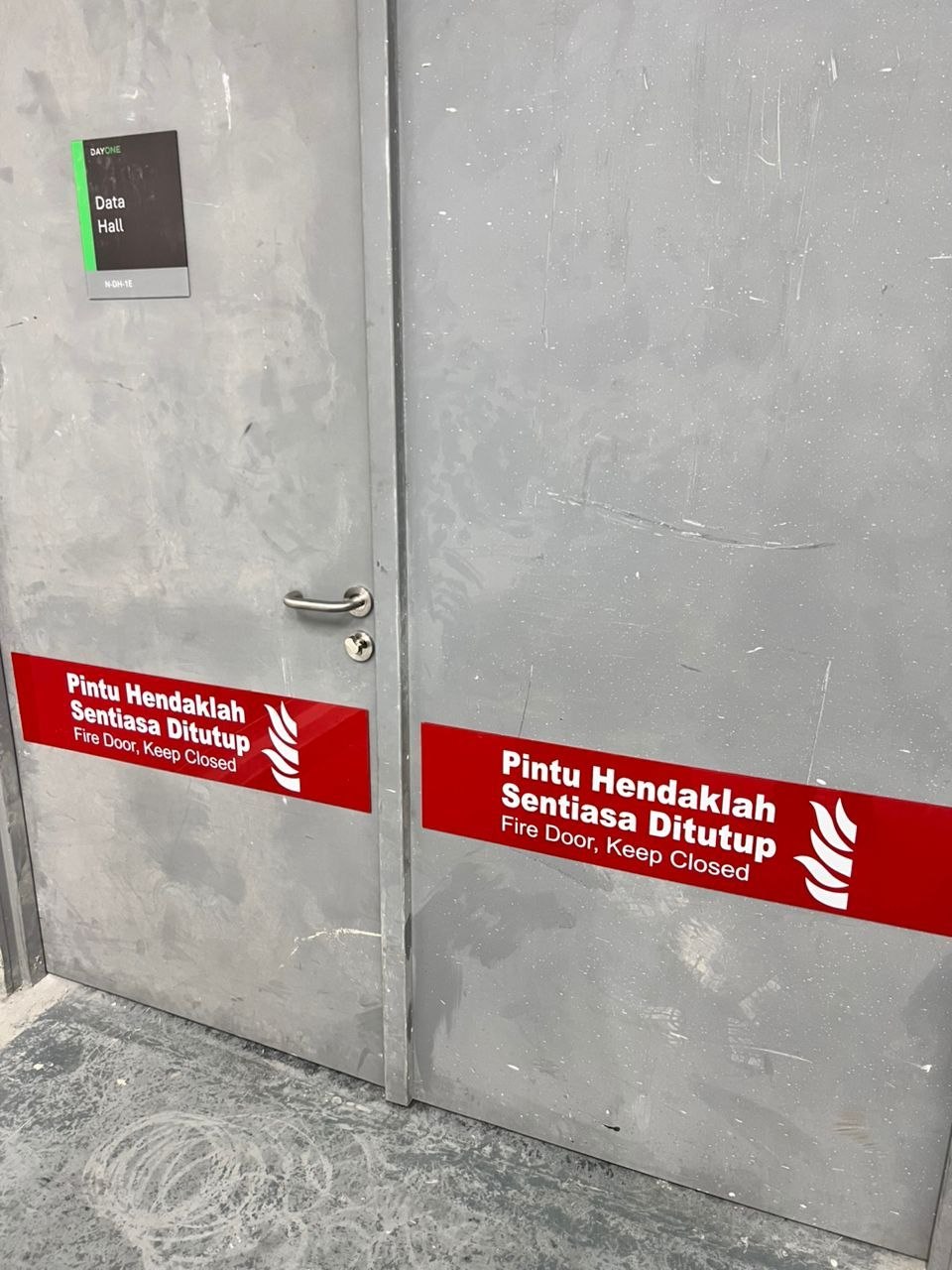 DayOne Data Hall room nameplate and fire door keep closed Bomba sign