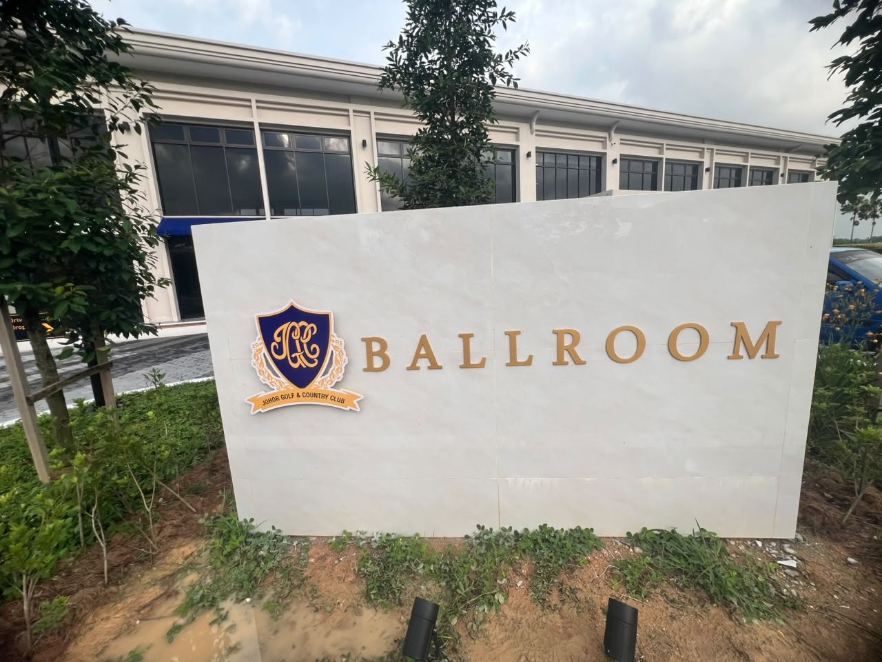 JGCC Ballroom building identification wall sign with gold lettering