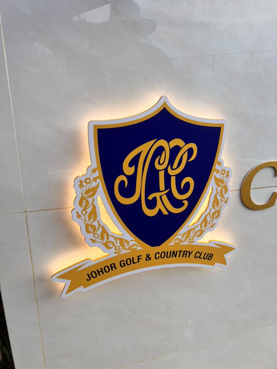 JGCC shield crest backlit LED halo sign close-up