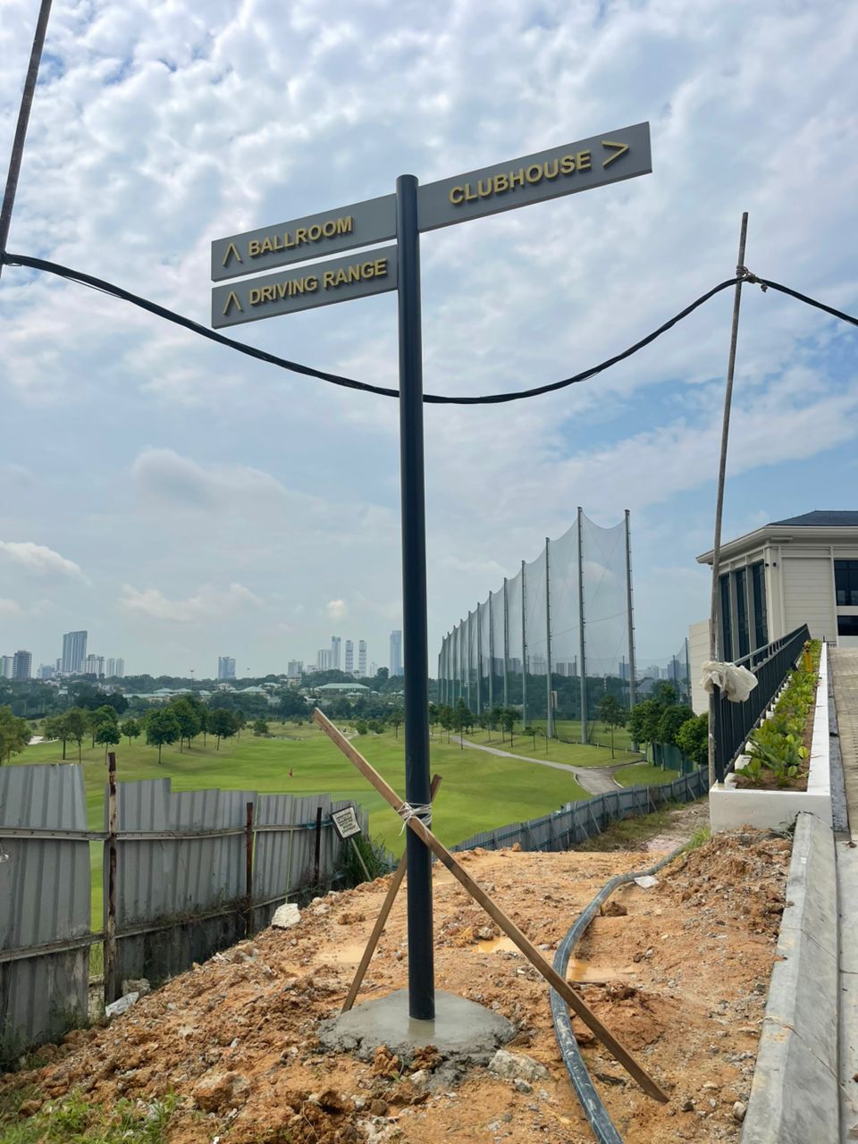 JGCC road direction sign for Clubhouse, Ballroom, and Driving Range