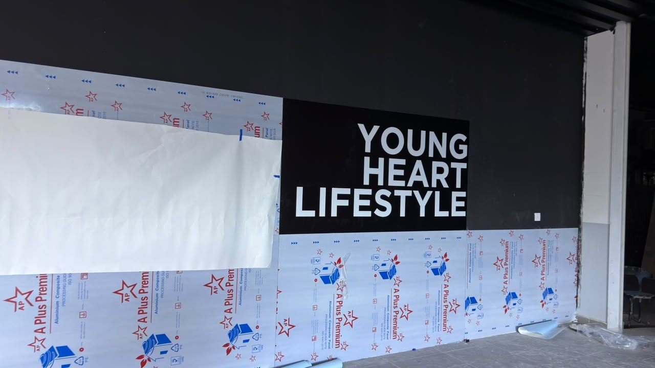 iCAR Kluang showroom Young Heart Lifestyle white vinyl cut sticker on black wall Johor