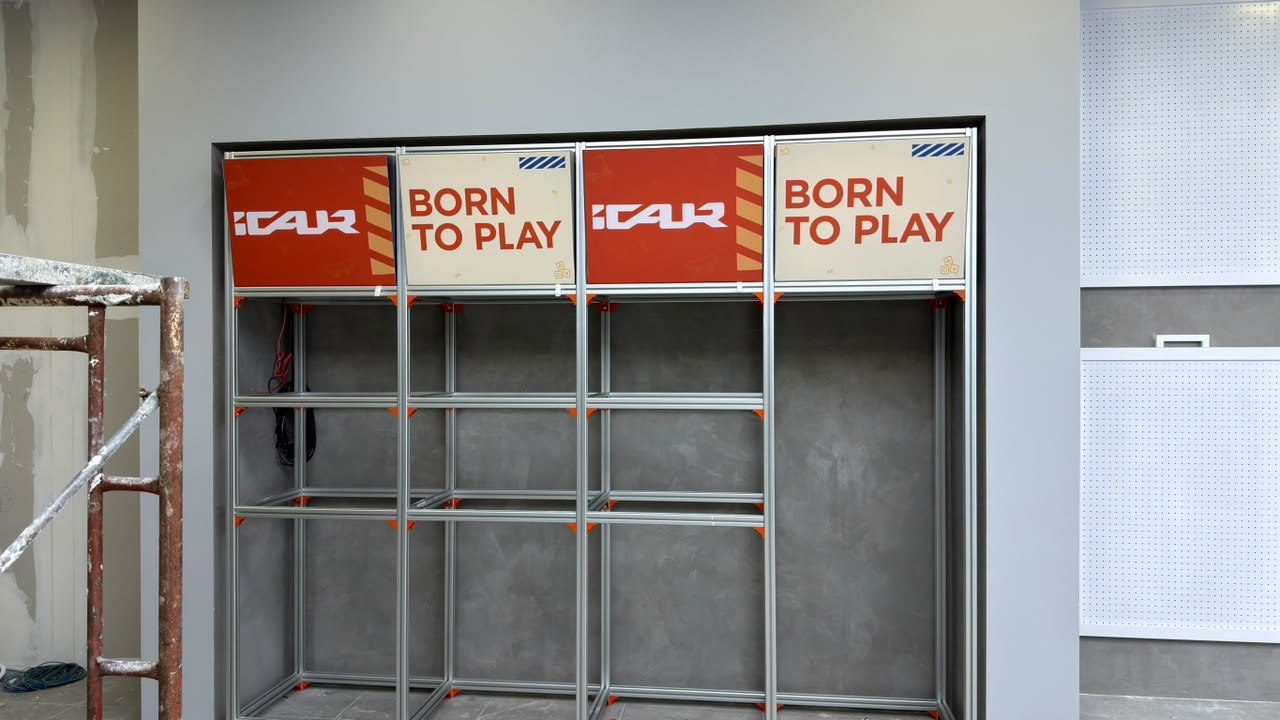iCAR Kluang showroom wardrobe display unit fabric lightbox panels with Born to Play branding Johor